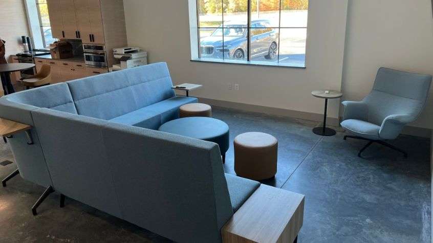 Comfortable employee lounge with sofas and seating at RPI Construction Equipment